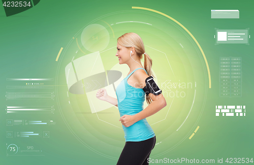 Image of woman with earphones and smartphone doing sports