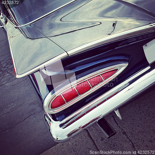 Image of Blue vintage car  in raindrops 