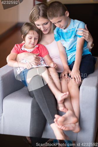 Image of Young Family Using A Tablet To Make Future Plans