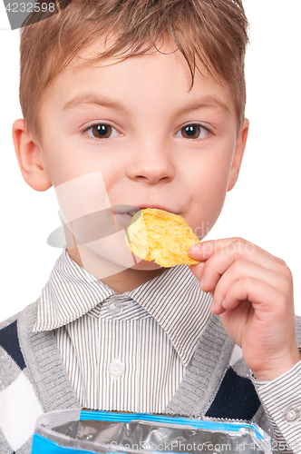 Image of Little boy with packet potato chips