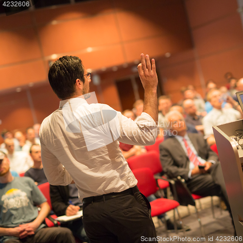 Image of Speaker at Business Conference and Presentation.