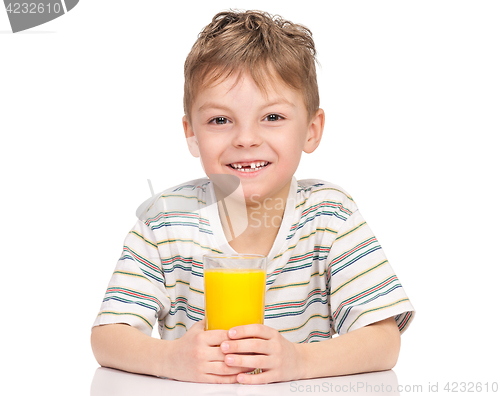 Image of Little boy drinking orange juice