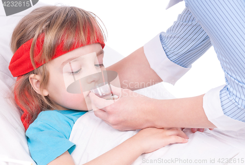 Image of Sick little girl in bed