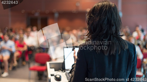 Image of Business woman lecturing at Conference.