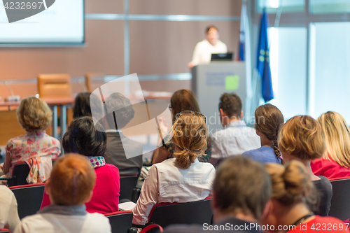 Image of Speaker giving presentation on business conference.