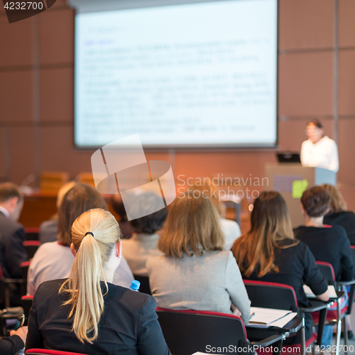 Image of Speaker giving presentation on business conference.