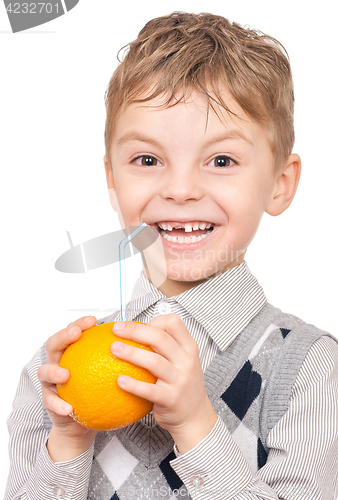 Image of Little boy drinking orange juice