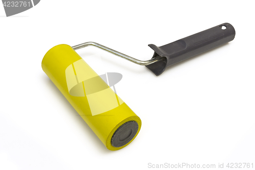 Image of Yellow rubber paint roller on a white background