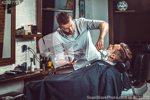 Image of Hipster client visiting barber shop