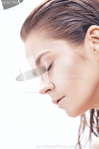 Image of Beautiful woman face portrait close up on blue