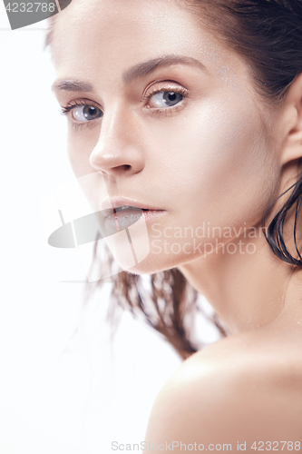 Image of Beautiful woman face portrait close up on blue
