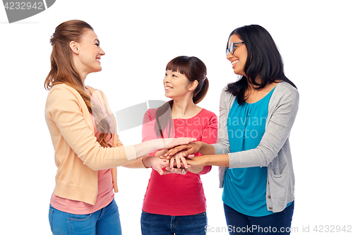 Image of international group of women with hands together