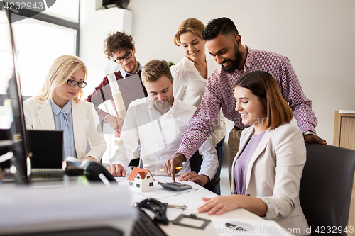 Image of business team discussing house project at office