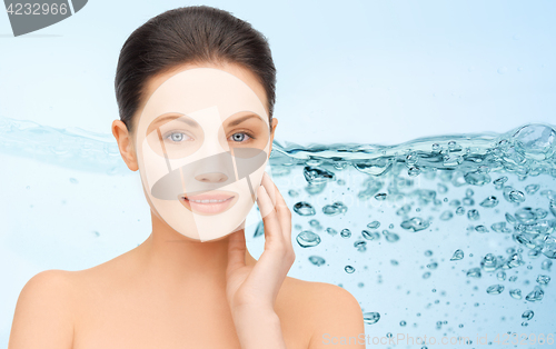 Image of beautiful young woman with collagen facial mask