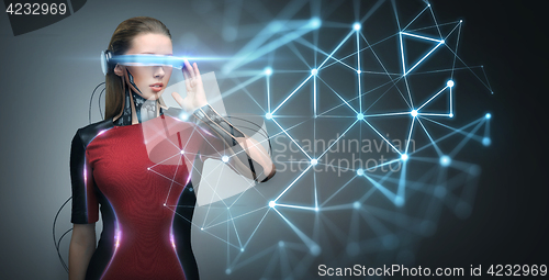 Image of woman in virtual reality glasses and microchip