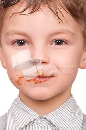 Image of Little boy eating chocolate