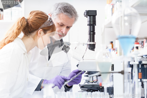 Image of Health care researchers working in scientific laboratory.