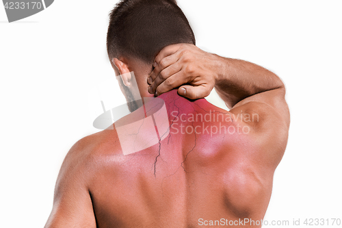 Image of Studio shot of man with pain in neck