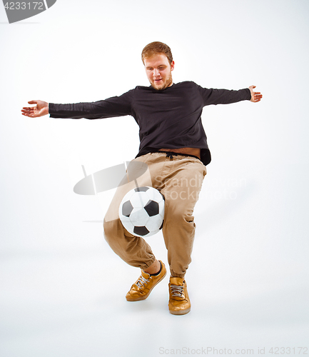 Image of The portrait of fan with ball on gray background
