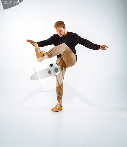 Image of The portrait of fan with ball on gray background