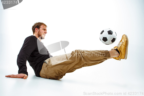 Image of The portrait of fan with ball on gray background