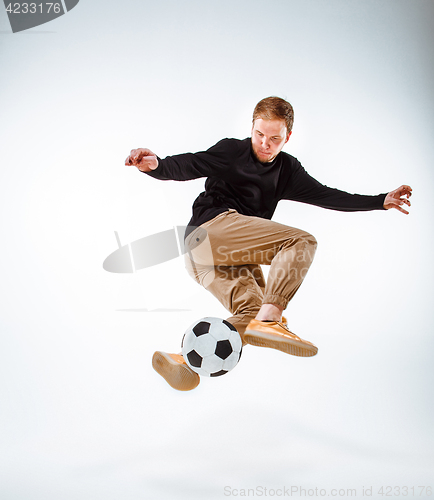 Image of The portrait of fan with ball on gray background