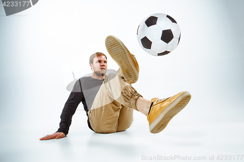 Image of The portrait of fan with ball on gray background