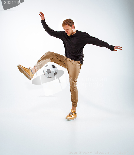 Image of The portrait of fan with ball on gray background