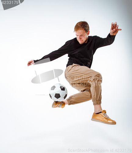 Image of The portrait of fan with ball on gray background