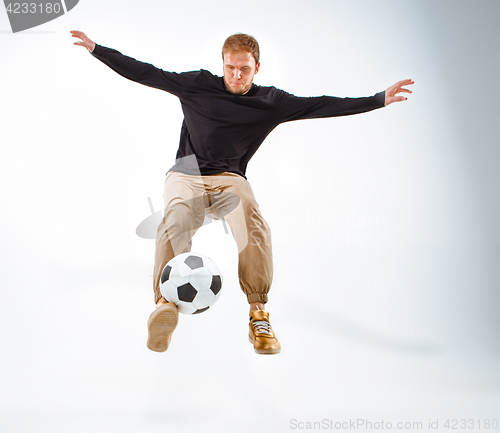 Image of The portrait of fan with ball on gray background