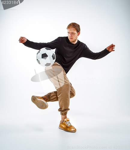 Image of The portrait of fan with ball on gray background