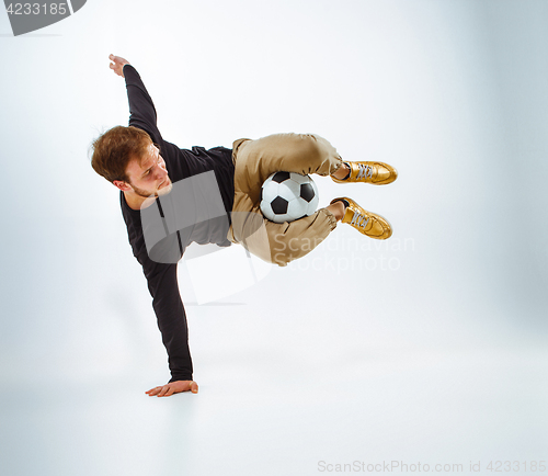 Image of The portrait of fan with ball on gray background