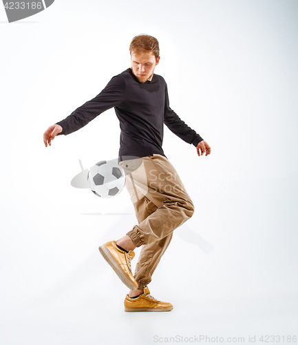 Image of The portrait of fan with ball on gray background