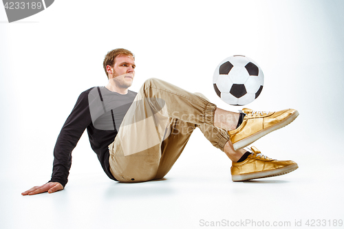 Image of The portrait of fan with ball on gray background