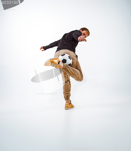 Image of The portrait of fan with ball on gray background