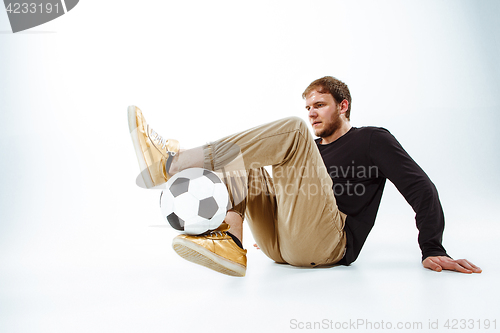 Image of The portrait of fan with ball on gray background