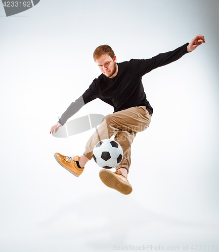 Image of The portrait of fan with ball on gray background