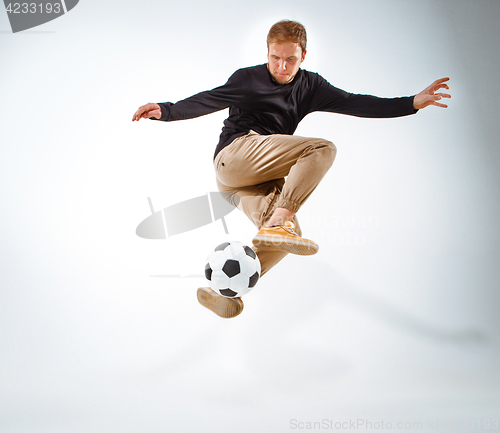 Image of The portrait of fan with ball on gray background