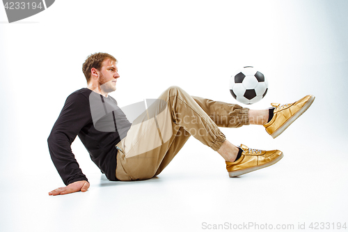 Image of The portrait of fan with ball on gray background