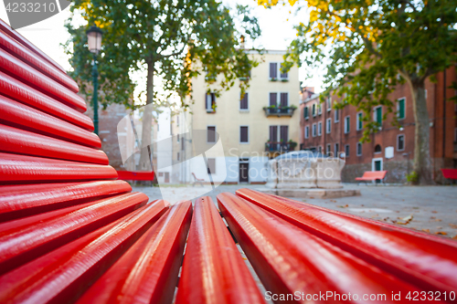 Image of Venice from a red bench