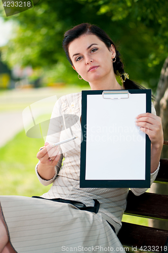 Image of Business woman in summer park