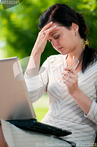 Image of Business woman in summer park