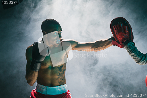 Image of Afro american male boxer.