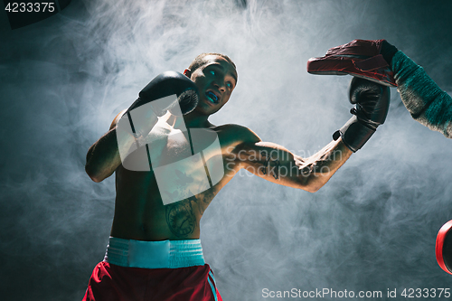 Image of Afro american male boxer.