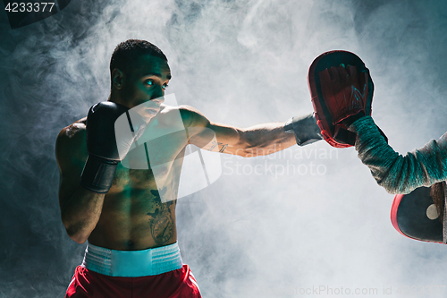 Image of Afro american male boxer.