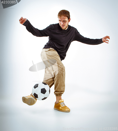 Image of The portrait of fan with ball on gray background