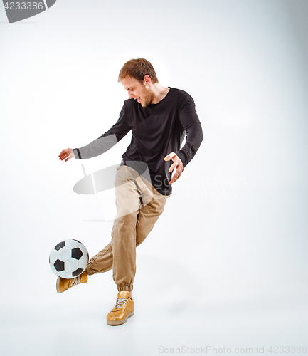 Image of The portrait of fan with ball on gray background