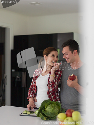 Image of Young handsome couple in the kitchen