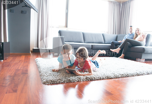 Image of couple spending time with kids