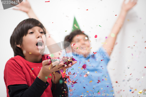 Image of kids  blowing confetti